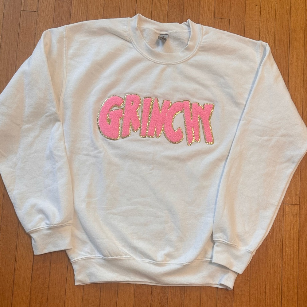 White Sweatshirt with Pink Grinch Design